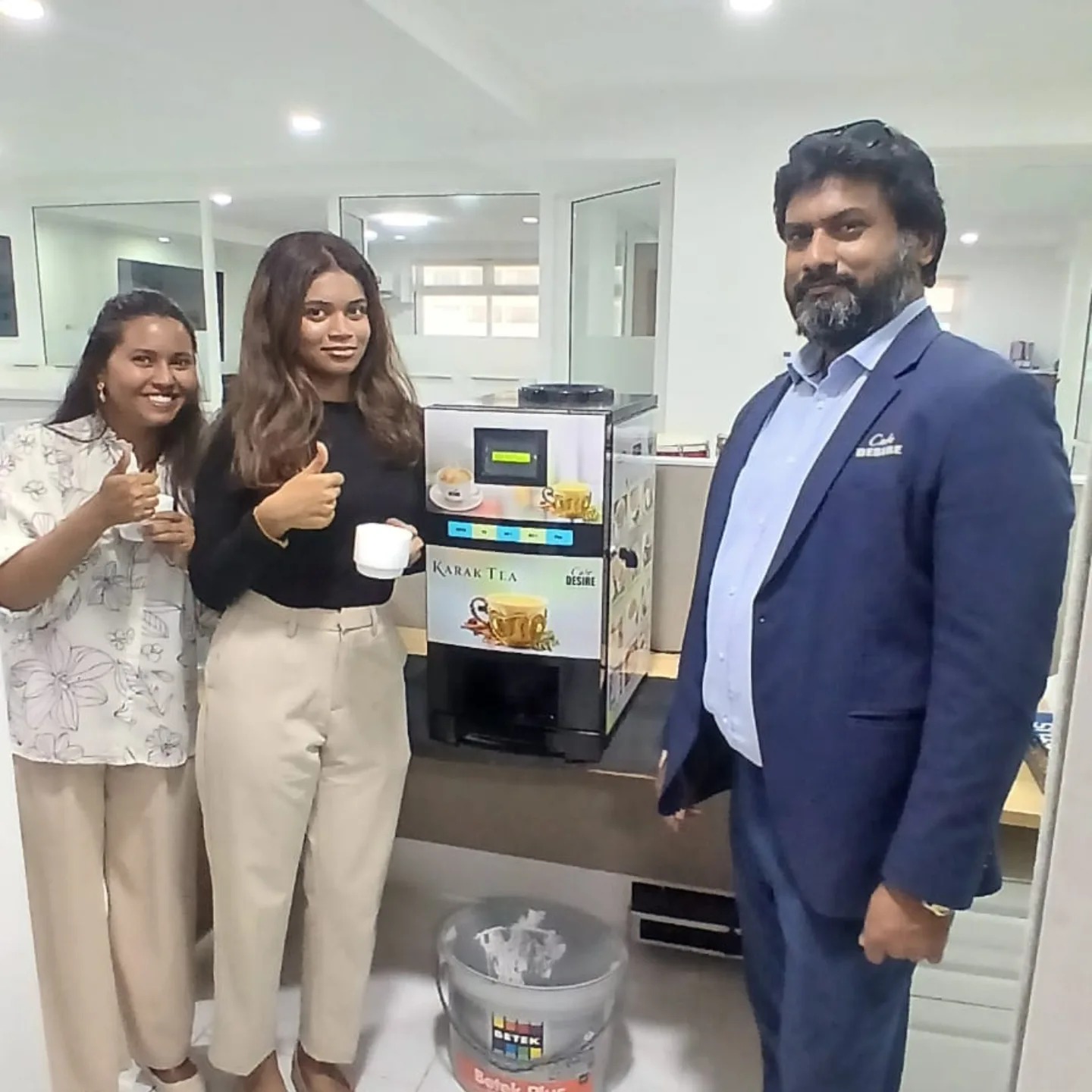 Office team enjoying Café Desire karak tea