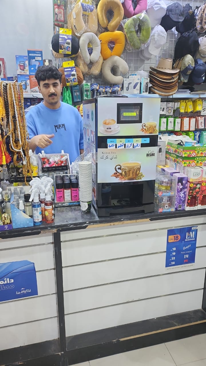 Café Desire karak machine at a retail showroom counter