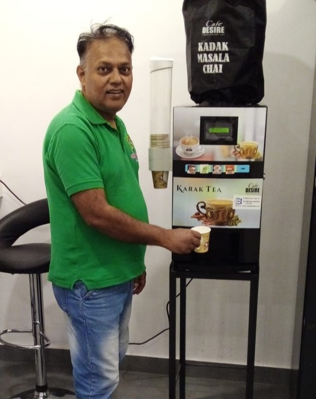 Factory staff using a Café Desire karak machine