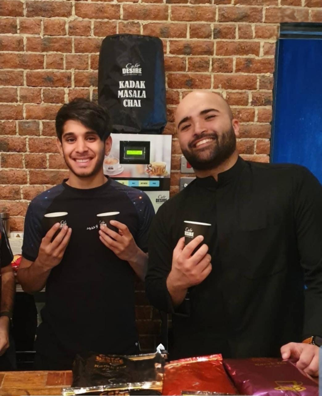Customers enjoying Café Desire karak tea at a retail outlet