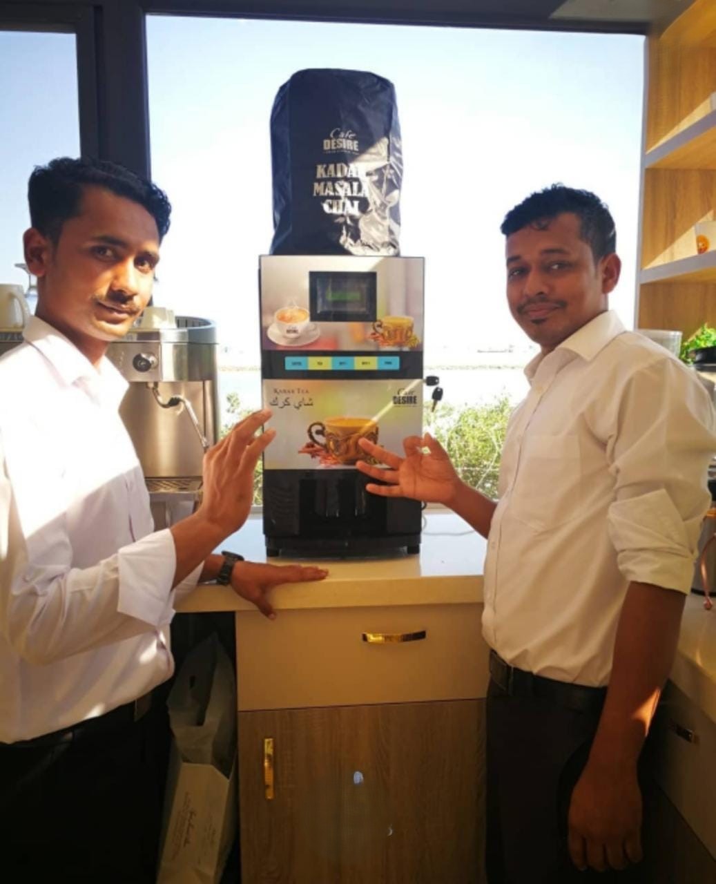 Office team with Café Desire karak machine by the window